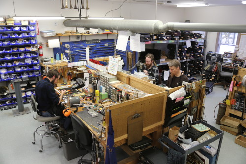 Photo of repair shop staff working