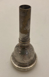 A mouthpiece with worn plating.