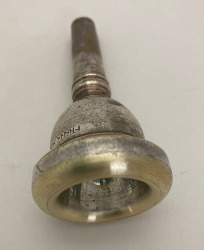 A mouthpiece with worn plating.