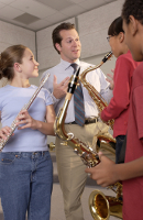 Photo of a music teacher and students